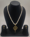 One line freshwater pearl necklace and earrings set with diamond-shaped green stone pendant and matching drop earrings