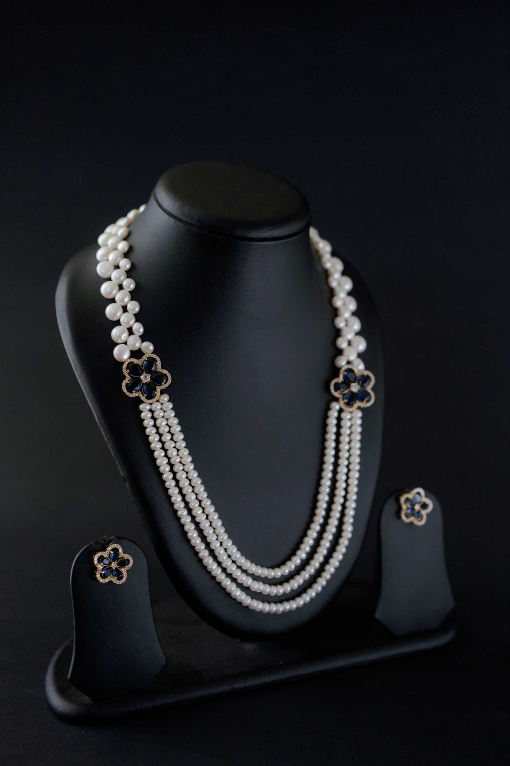 Midnight Bloom Multi-Strand Freshwater Pearl Broach Set with Deep Blue Floral Motifs and Matching Earrings