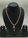 One line freshwater pearl necklace and earrings set with teardrop pendant and blush-pink and ivory pearls