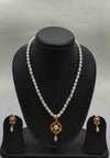 One line freshwater pearl necklace and earrings set with sculpted teardrop pendant and gold-accented pearls