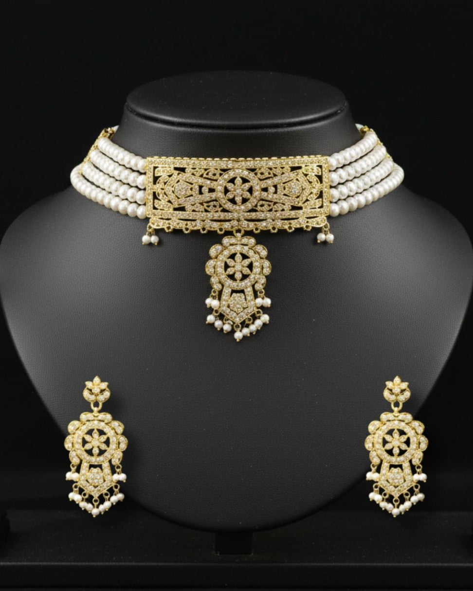 gold toned multi strand white pearl choker set with traditional filigree design and matching earrings for bridal wear