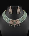 pale green multi-strand beaded choker set with white and light green CZ pendant and matching earrings