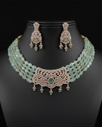 pale green multi-strand beaded choker set with white and light green CZ pendant and matching earrings