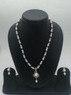 One line freshwater pearl necklace and earrings set with sculpted silver-toned pendant and dangling pearl
