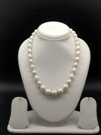 One-line South Sea white round pearl mala with graduated 8 mm to 14 mm pearls.