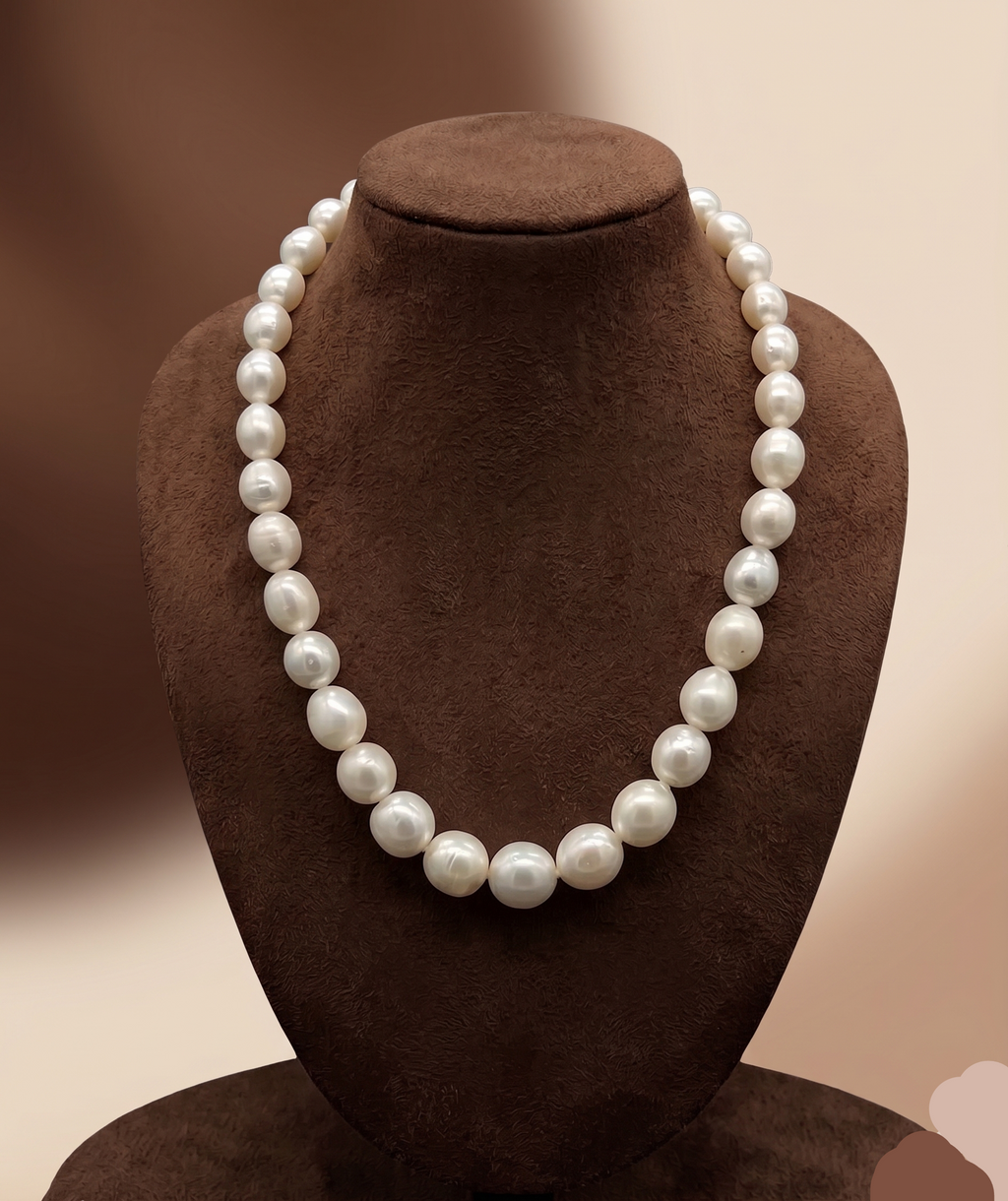 One-line South Sea white round pearl mala with graduated 8 mm to 14 mm pearls.