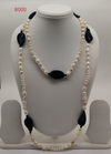 Onyx Whisper freshwater pearl necklace with white pearls and black onyx beads in layered design