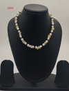 Pearl Mirage Layers freshwater pearl necklace with irregular white pearls and gold bead accents in layered design