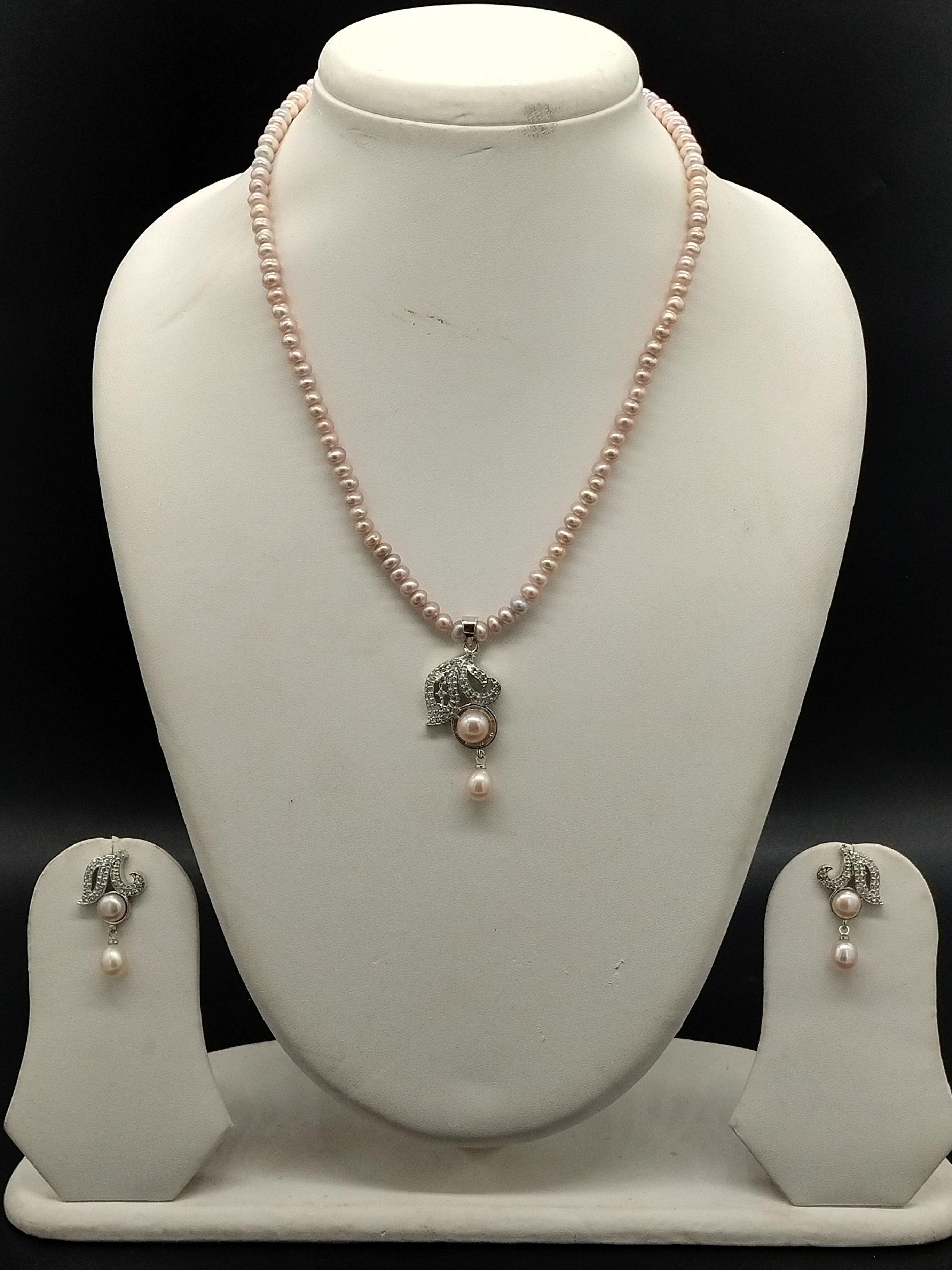 Pink freshwater pearl pendant necklace set with swan design pendant and matching earrings