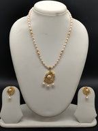 Pink freshwater pearl pendant necklace set with oval pearls and gold designer pendant with matching earrings