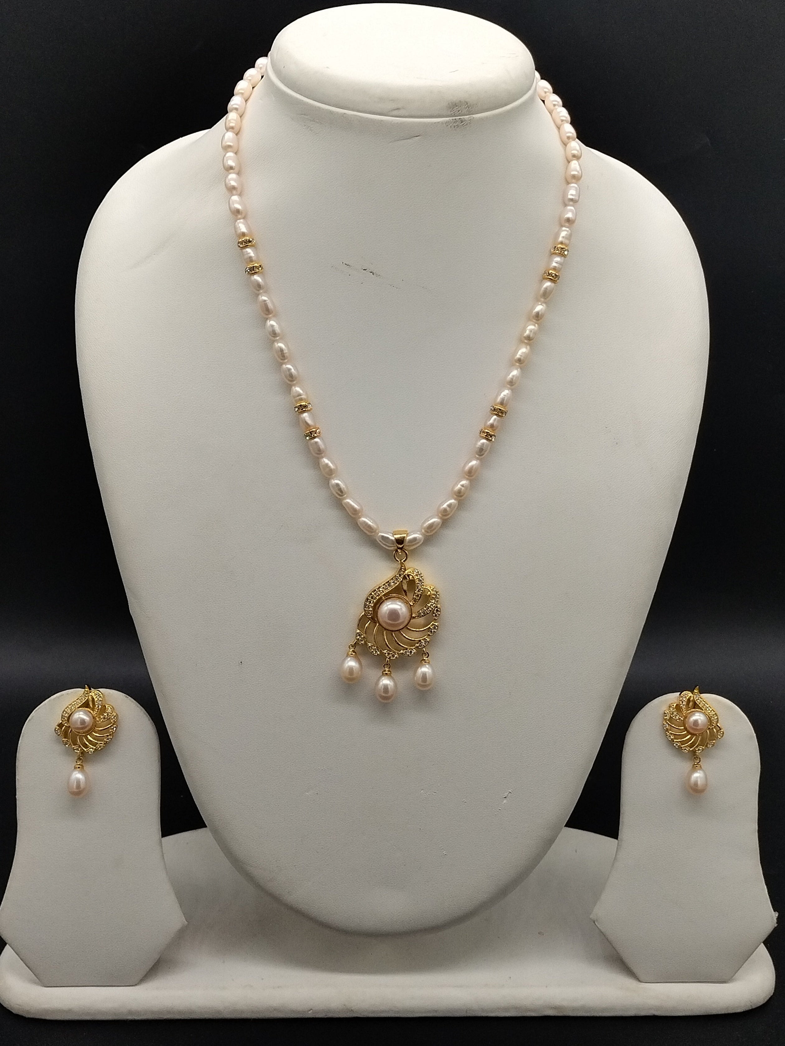 Pink freshwater pearl pendant necklace set with oval pearls and gold designer pendant with matching earrings