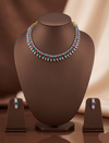 Pink, green and white American Diamond necklace set with matching drop earrings and rhodium finish.