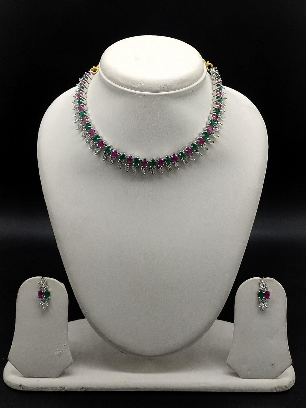 Pink, green and white American Diamond necklace set with matching drop earrings and rhodium finish.