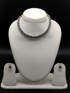 Pink, green and white American Diamond necklace set with matching drop earrings and rhodium finish.