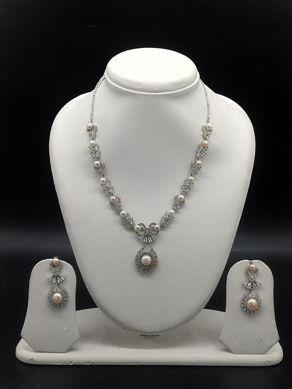 Pink pearl necklace set with white stones and matching earrings