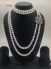 Regal Radiance freshwater pearl choker necklace set with layered round white pearls and stone-studded silver clasp