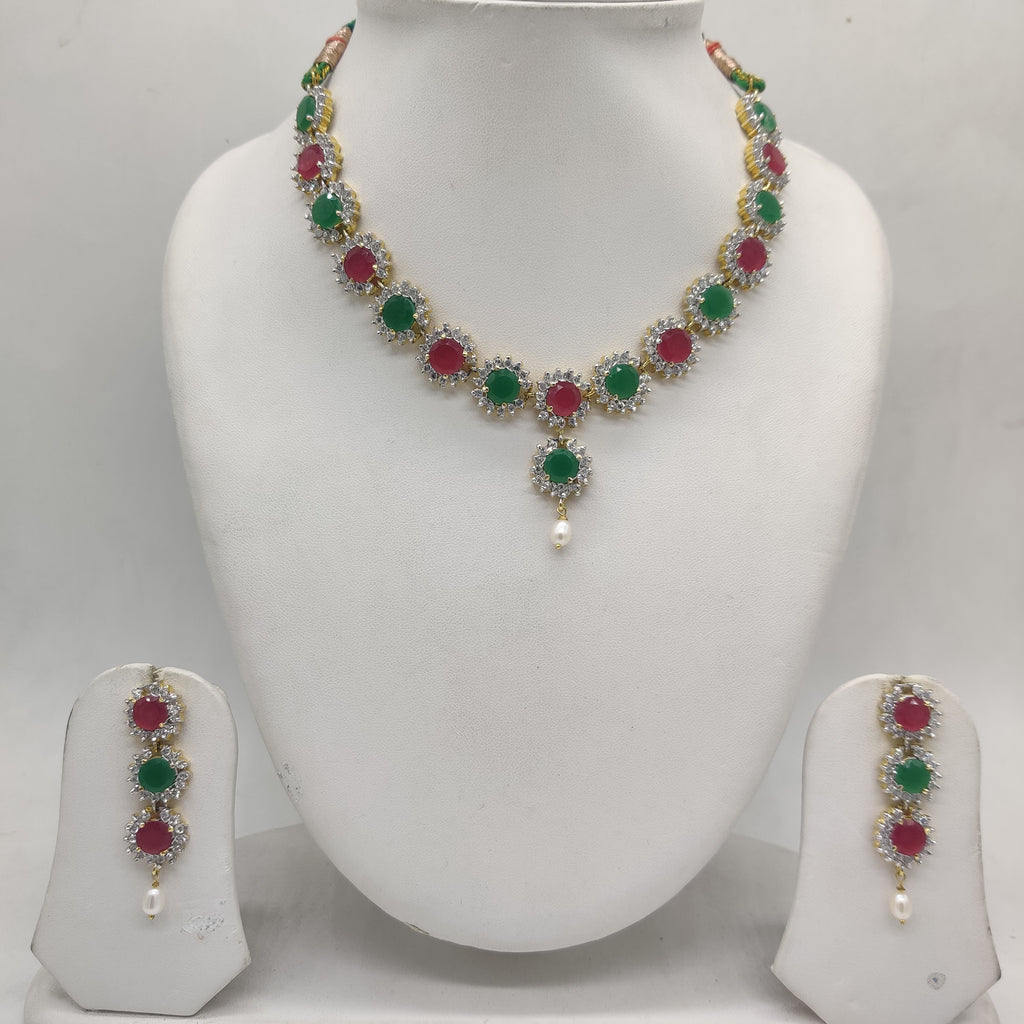 Royal Bloom multicolour CZ necklace set with floral design, pearl accent, and matching three-tier earrings.