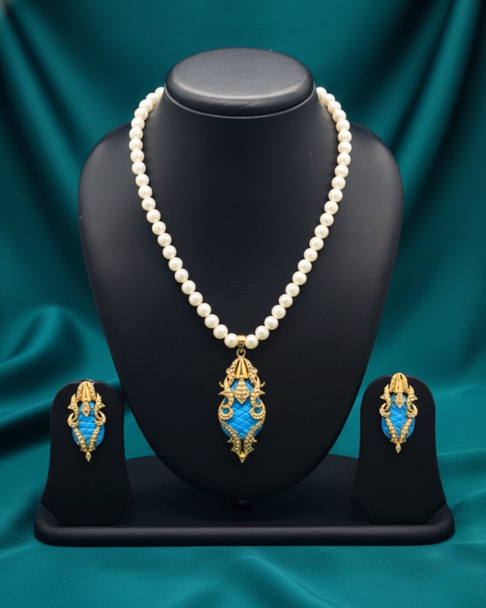 One line freshwater pearl necklace and earrings set with gold and blue stone pendant and matching earrings
