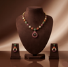 Royal Navratna CZ necklace set with multicolour stones and matching drop earrings.