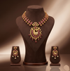 Royal Red CZ peacock necklace set with matte gold finish and matching peacock earrings.