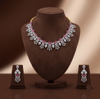 Royal white and pink CZ floral fringe necklace set with matching rhodium-plated earrings.