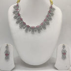 Royal white and pink CZ floral fringe necklace set with matching rhodium-plated earrings.