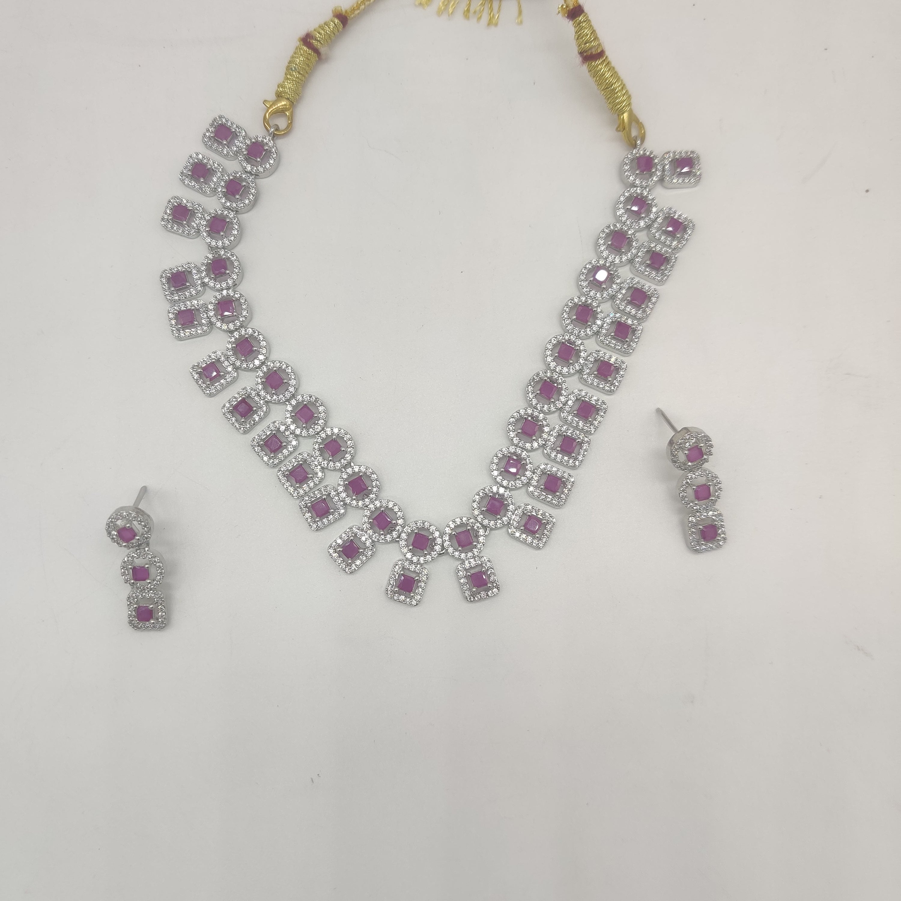 Royal white and red CZ geometric choker necklace set with matching rhodium-plated drop earrings.