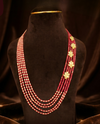Ruby Royale five layer necklace with semi-precious red beads, Mother of Pearl, and floral side brooch.