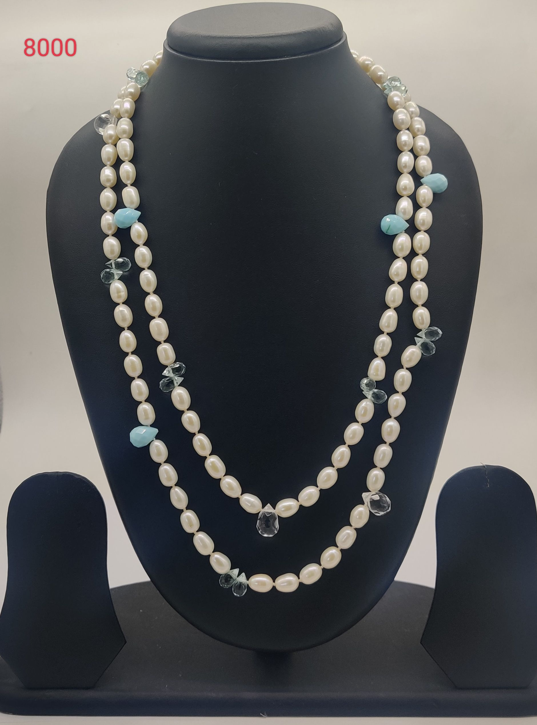 Serene Bloom freshwater pearl necklace with irregular white pearls and light blue beads in two strand design
