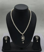 One line freshwater pearl necklace and earrings set with sculpted silver-toned pendant and teardrop pearl