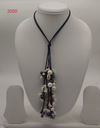 Statement Pearl Rainfall Drape freshwater pearl necklace set with cascading multi-tone pearls on black cord