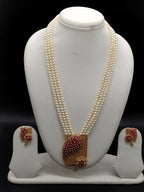 Three-line white freshwater pearl Rani Haar necklace set with ruby stone pendant and matching earrings