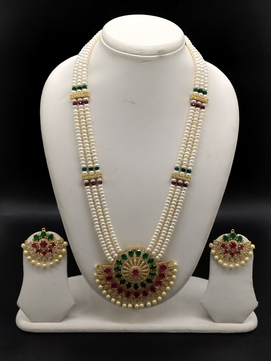 Three-line white freshwater pearl Rani Haar necklace set with red and green stone detailing and matching earrings