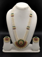 Three-line white freshwater pearl Rani Haar necklace set with red and green stone detailing and matching earrings