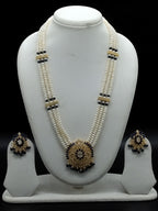 Three-line white freshwater pearl Rani Haar necklace set with blue stone pendant and matching earrings