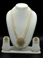 Three-line white freshwater pearl Rani Haar necklace set with gold-toned pendant and matching earrings
