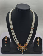 Three line freshwater pearl pendant necklace set with white flat pearls and pink stone pendant