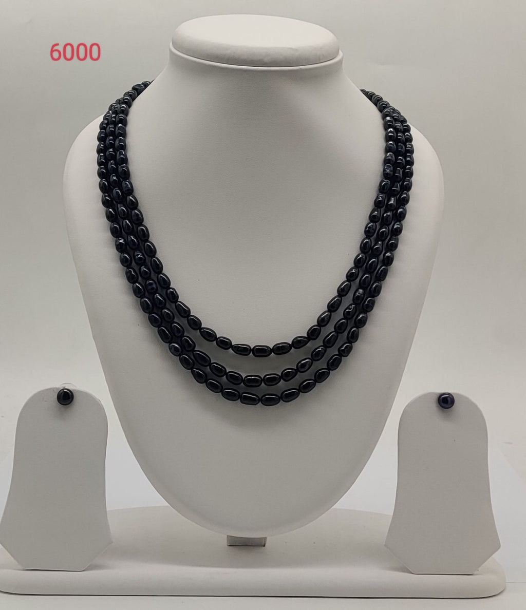 triple strand black freshwater pearl necklace and earrings set noir orbit oval pearls