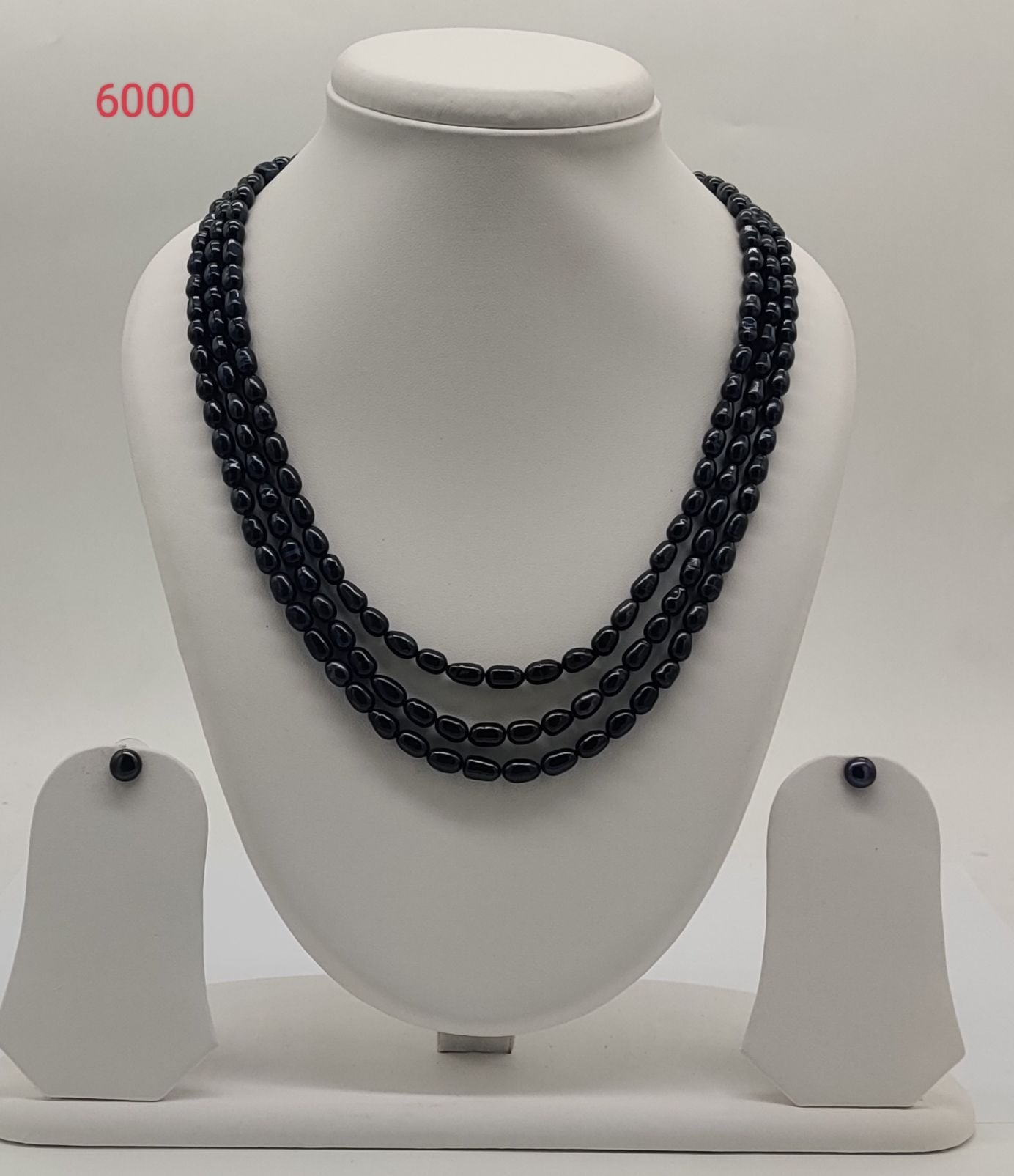 triple strand black freshwater pearl necklace and earrings set noir orbit oval pearls