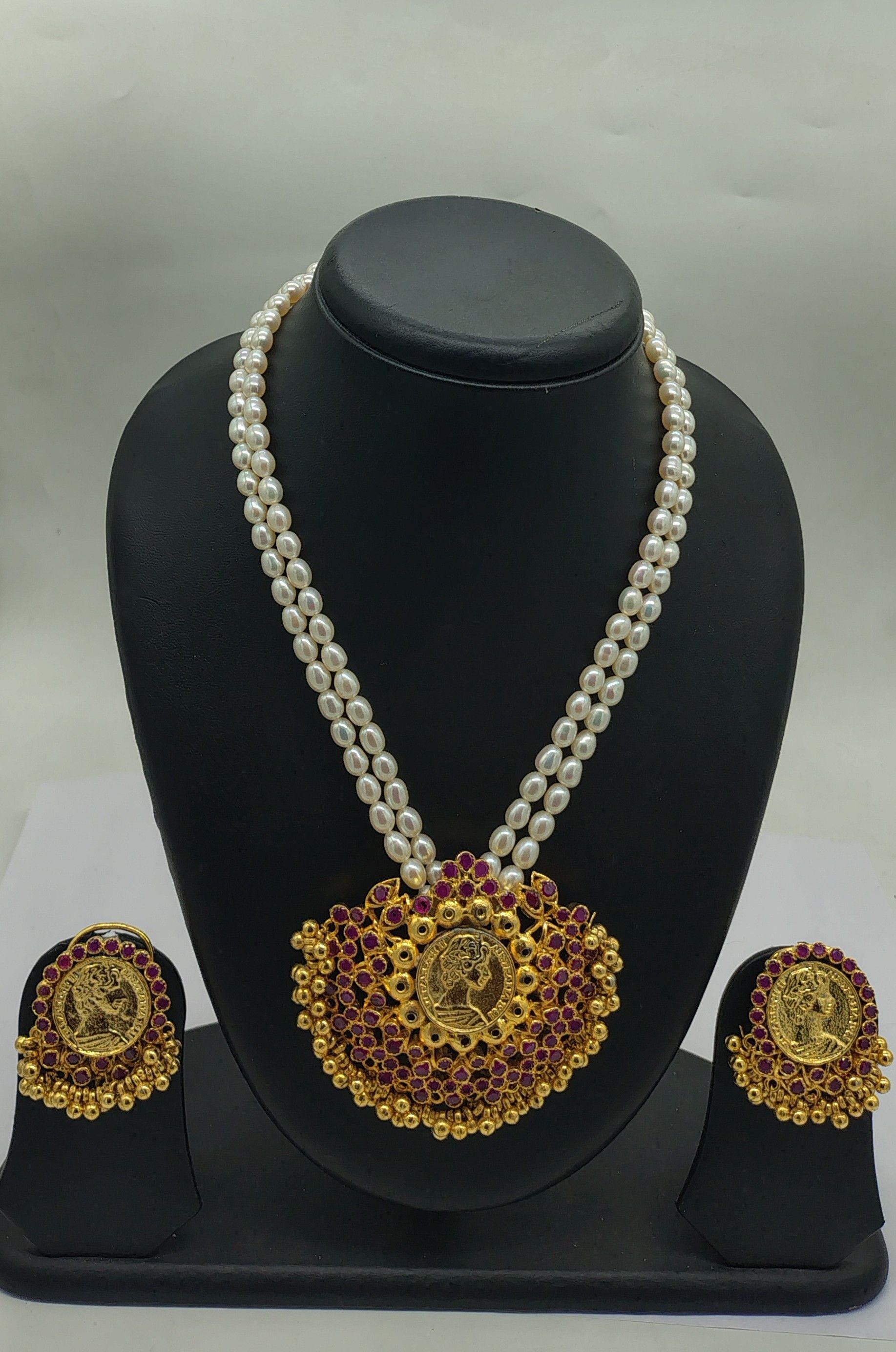 Heritage Coin two line freshwater pearl pendant necklace set with oval white pearls and ruby red coin pendant