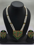 Emerald Cascade two line freshwater pearl pendant necklace set with oval white pearls and emerald green rectangular pendant