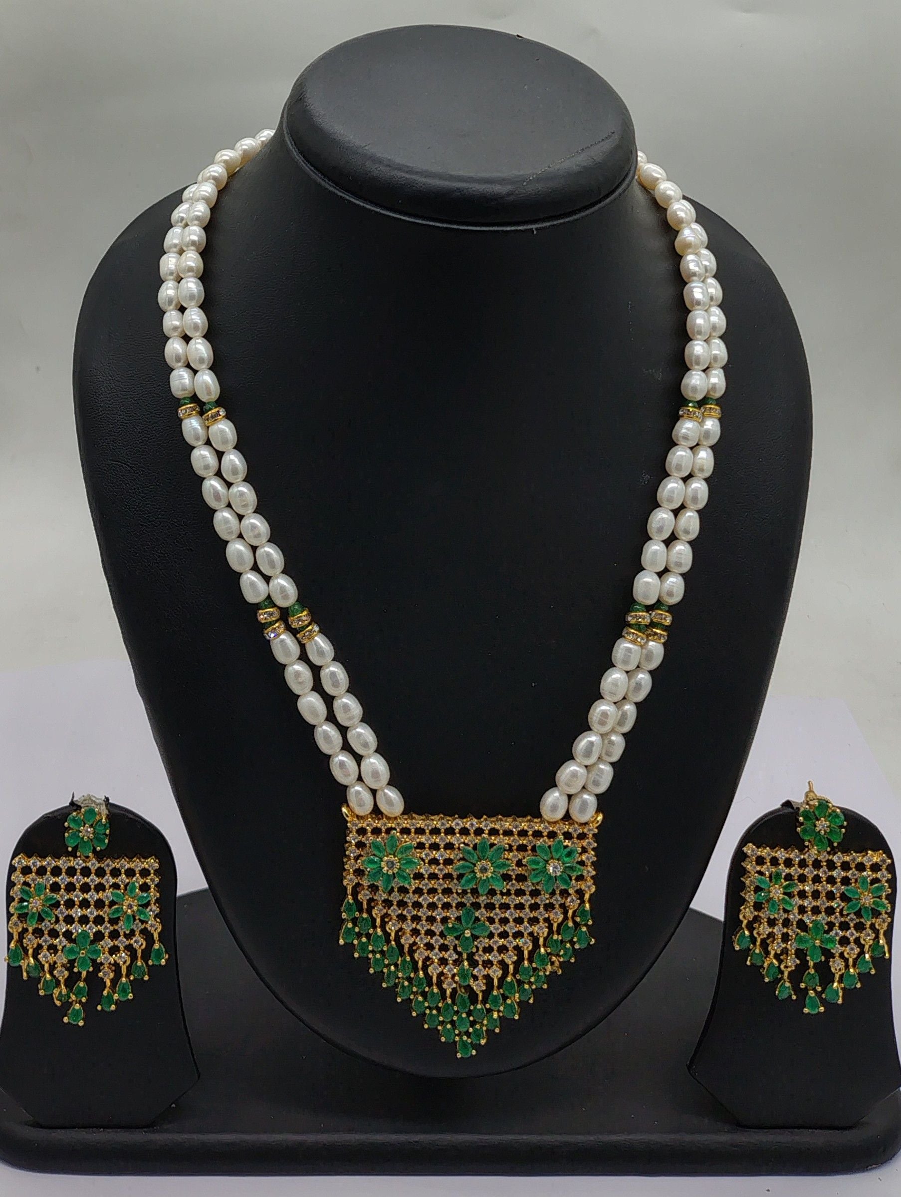 Emerald Cascade two line freshwater pearl pendant necklace set with oval white pearls and emerald green rectangular pendant