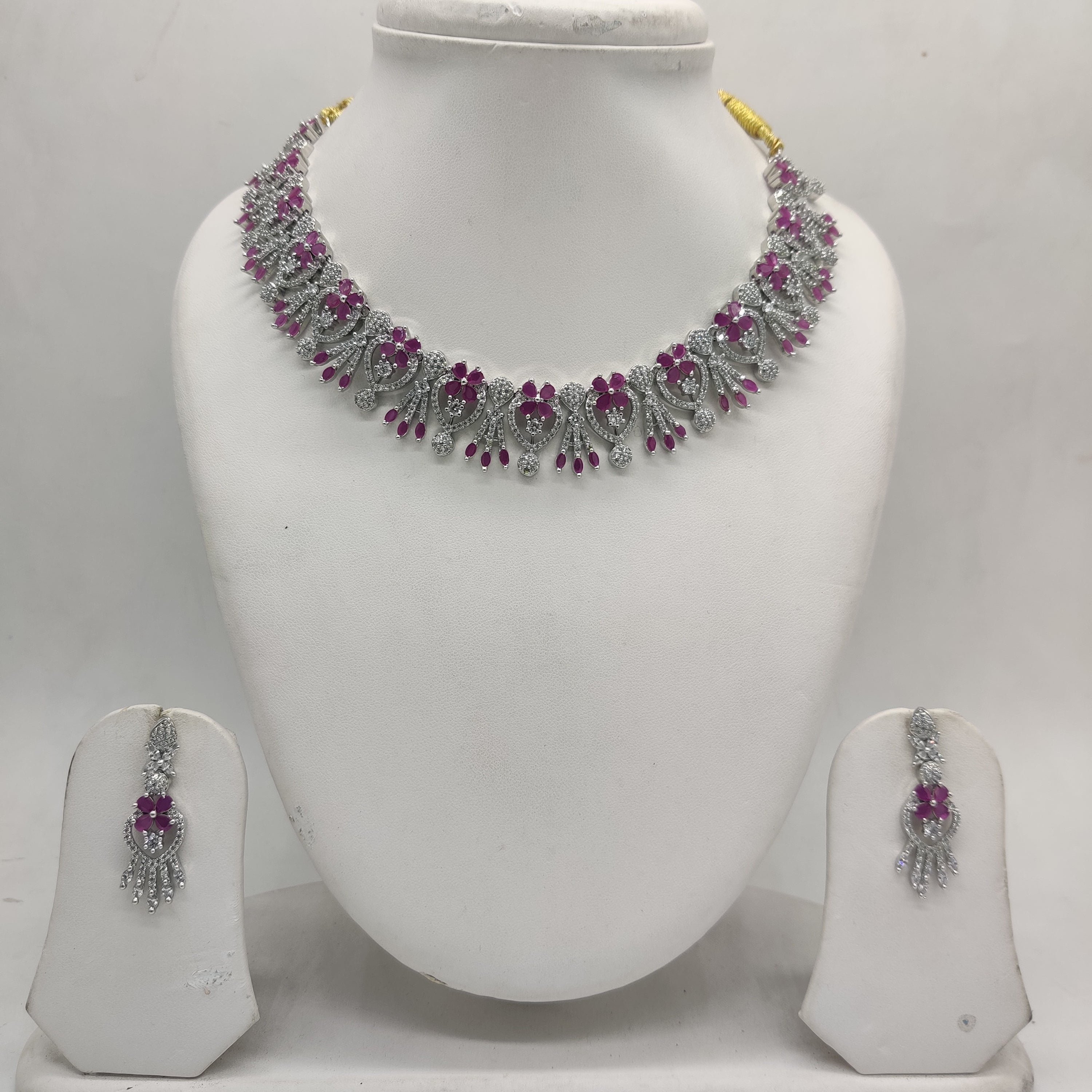 White and red American Diamond floral necklace set with matching drop earrings.