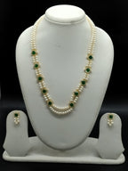 White freshwater pearl pendant necklace set with two line flat pearls and green stone gold accents