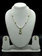 White freshwater pearl pendant necklace set with green stone dual circle pendant and oval pearls