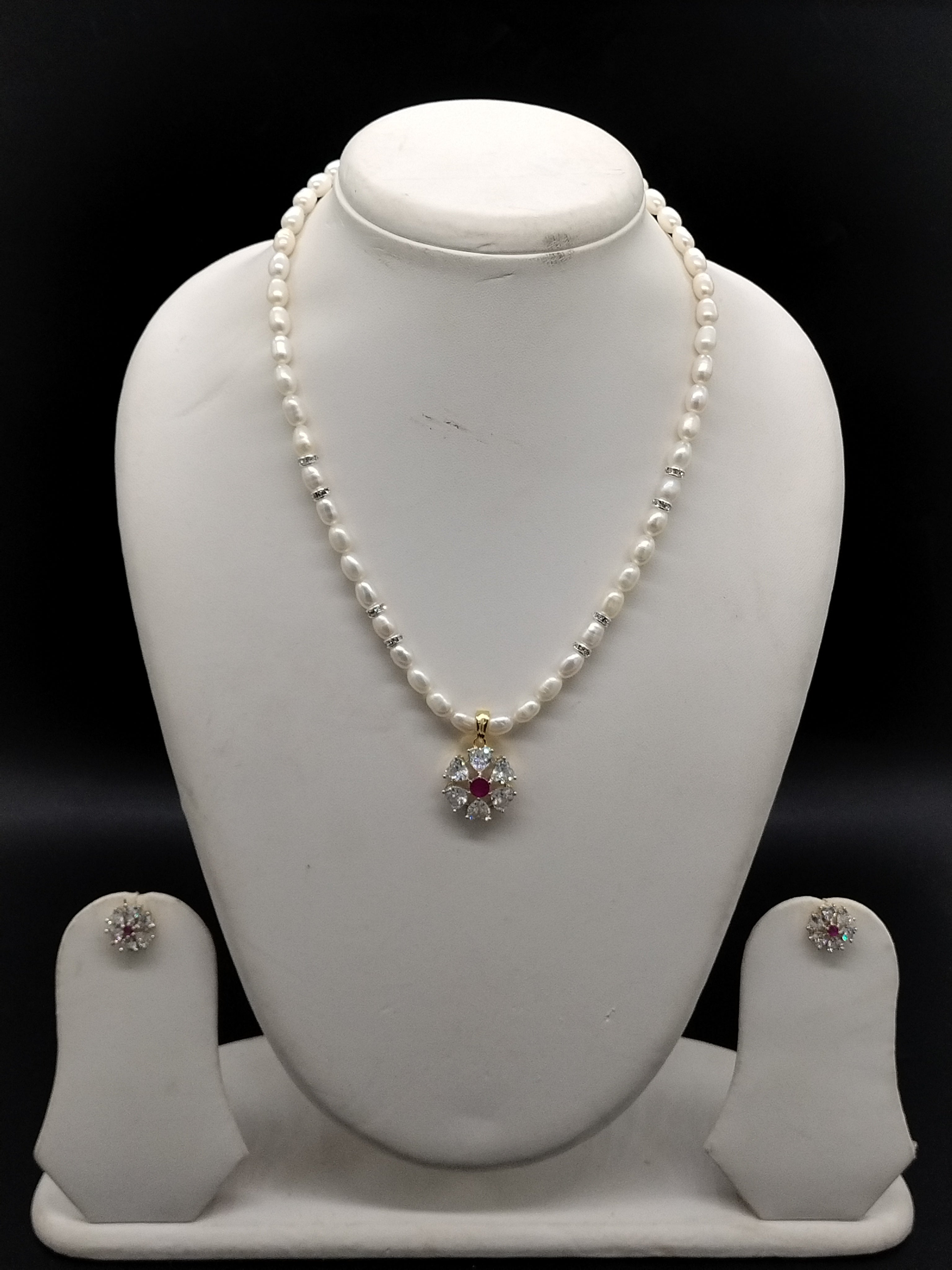 White freshwater pearl pendant necklace set with red stone floral pendant and oval pearls