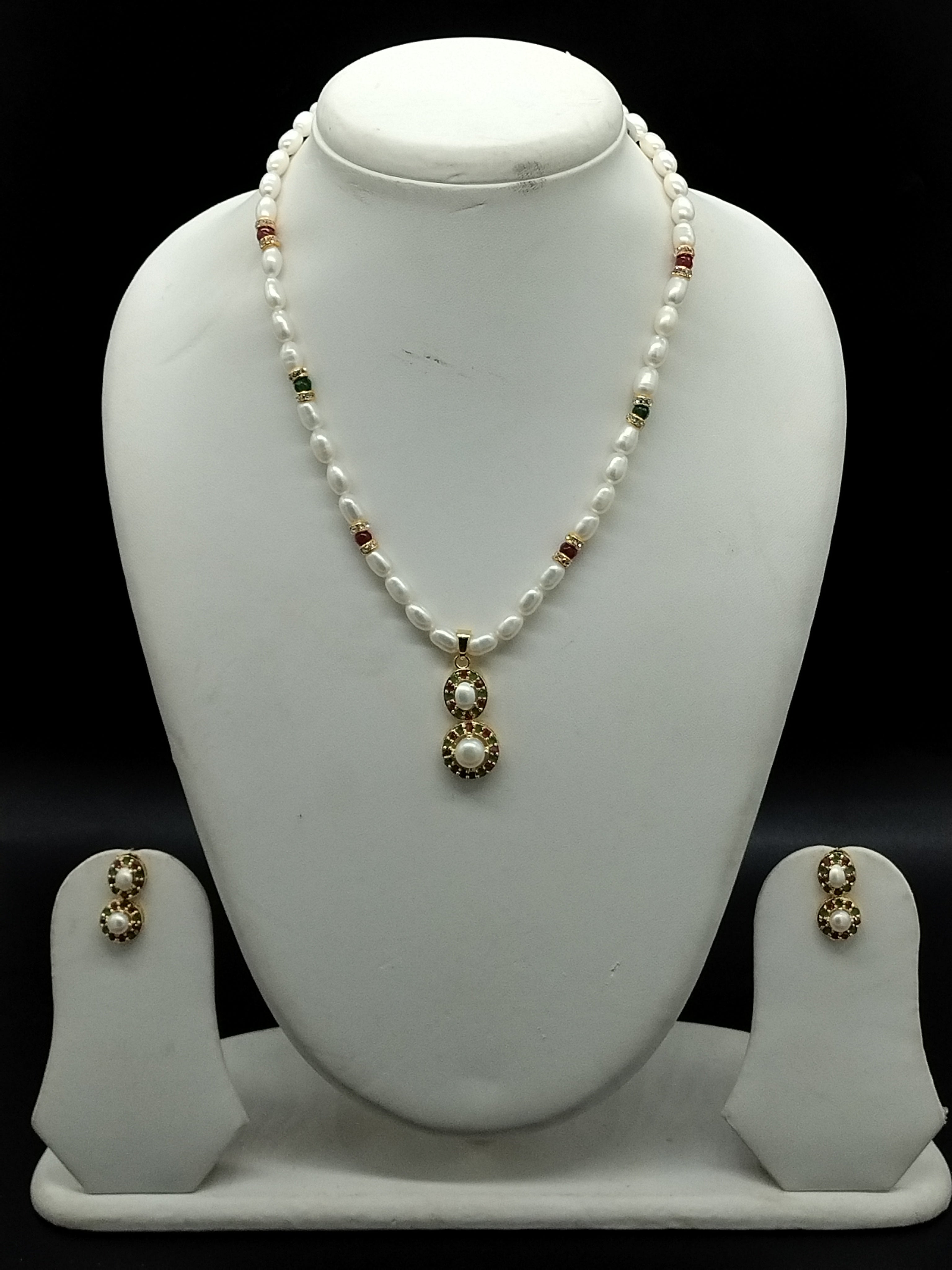 White freshwater pearl pendant necklace set with red and green stone gold pendant and oval pearls