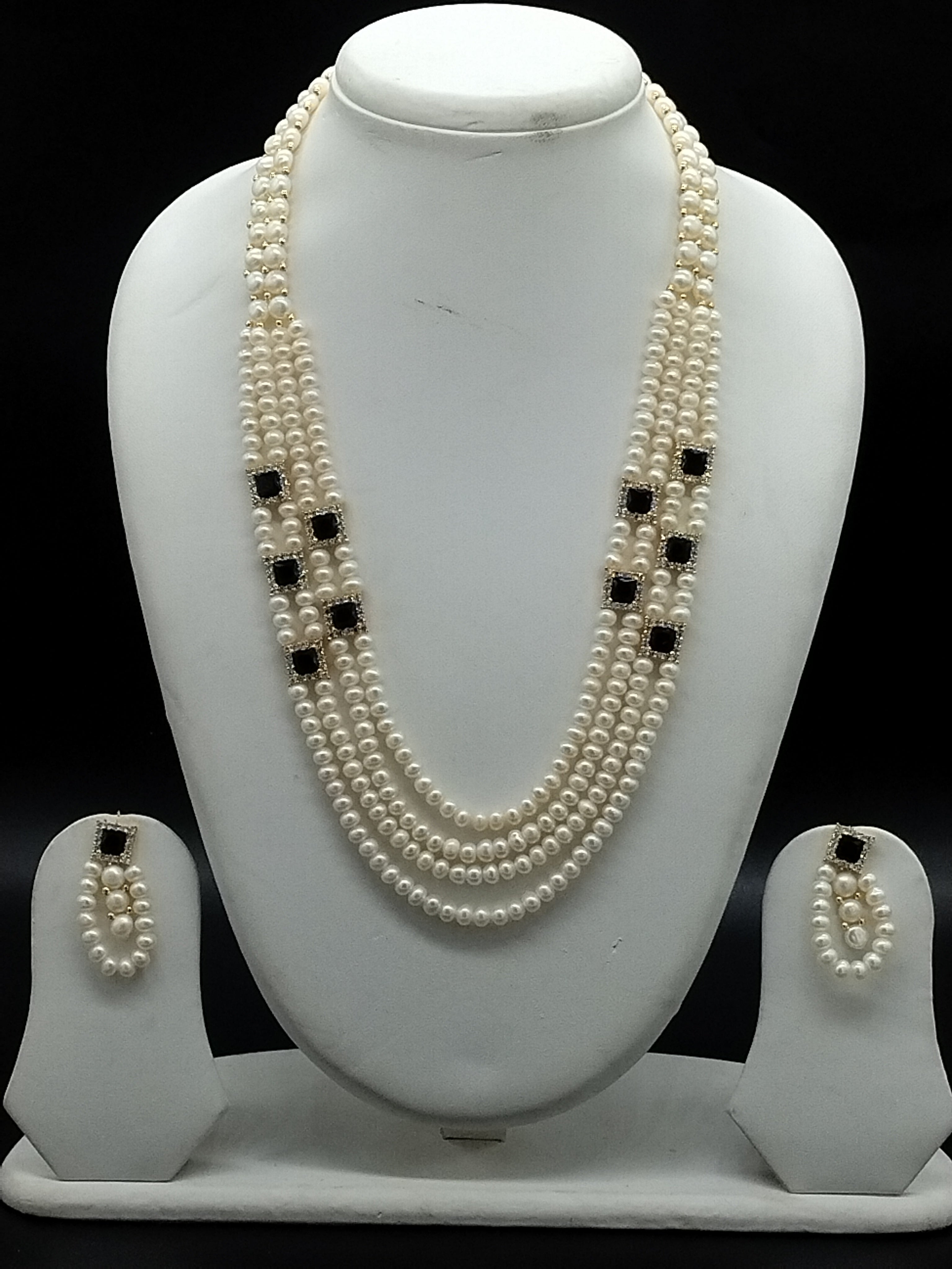 White freshwater pearl layered necklace set with black stone accents and matching earrings
