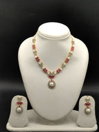 White freshwater pearl necklace set with red stones and floral pendant for women
