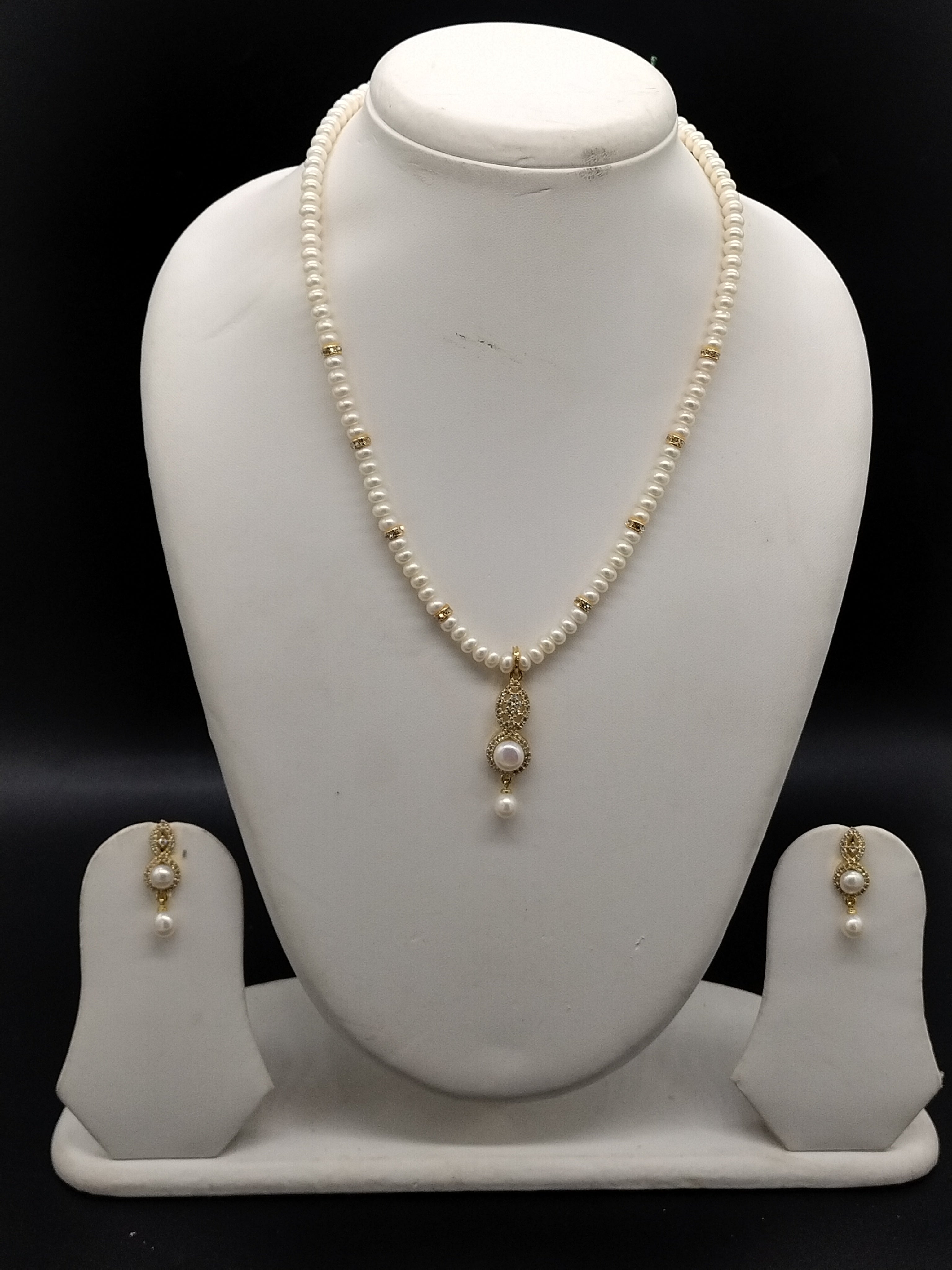 White freshwater pearl one line pendant necklace set with gold pendant and matching pearl earrings